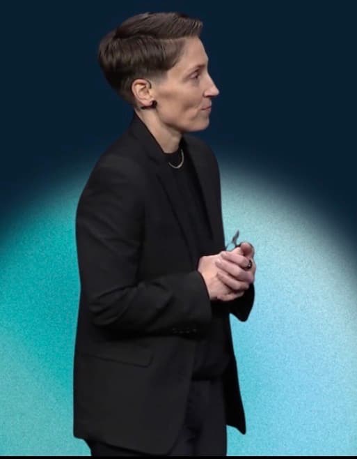 Cheri Hewlett speaking on stage